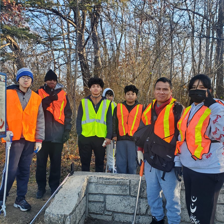 Volunteers in safety vests before a clean-up