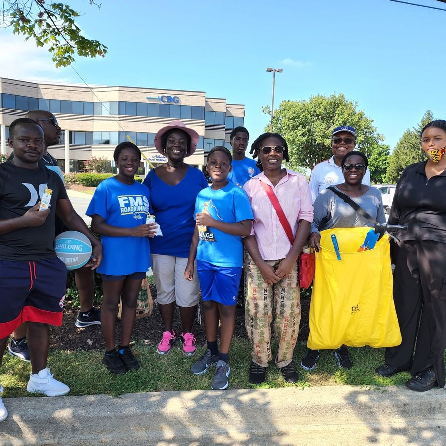 Young volunteers together at a community clean-up