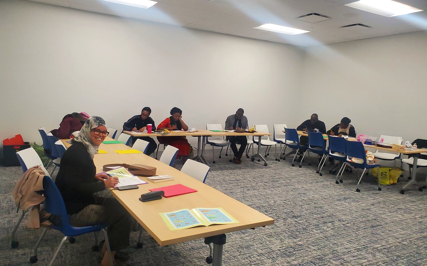 Participants working through paperwork at an FAA workshop