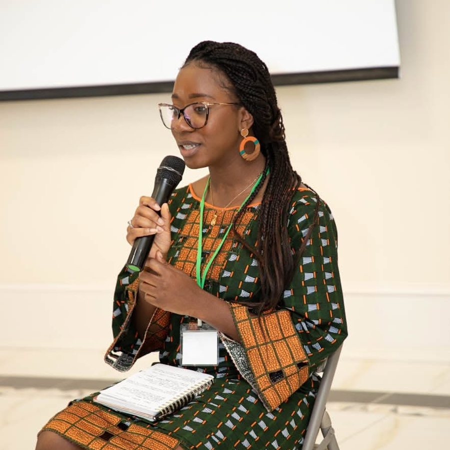 A young speaker addressing the audience